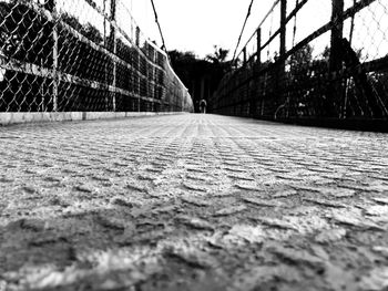 Surface level of walkway along fence