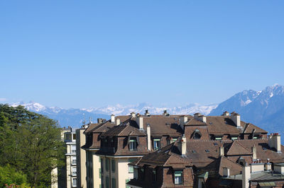 Houses against clear blue sky