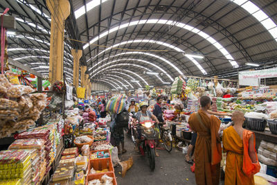 Group of people at market stall