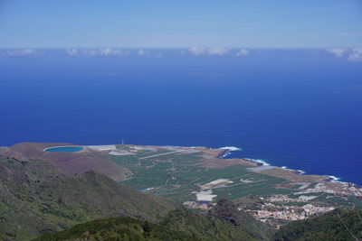 High angle view of sea and shore against sky