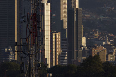 Modern buildings in city against sky