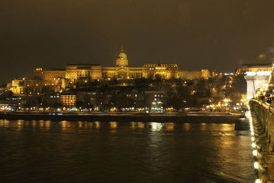 Illuminated buildings at waterfront