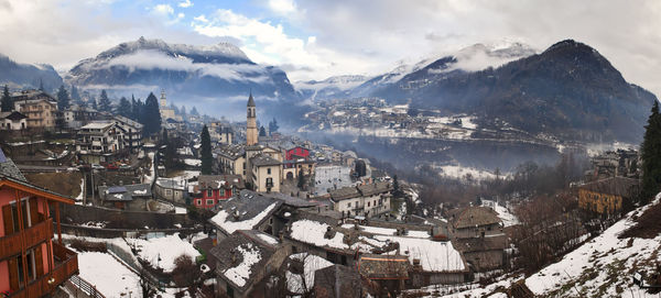 Aerial view of townscape against sky during winter