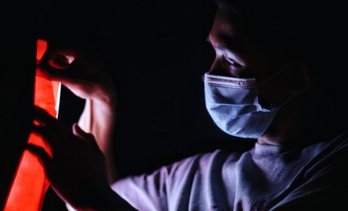 Close-up portrait of man at night