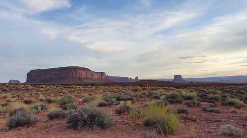 Rock formations on landscape against sky