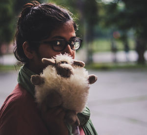 Portrait of teenage girl with stuffed toy