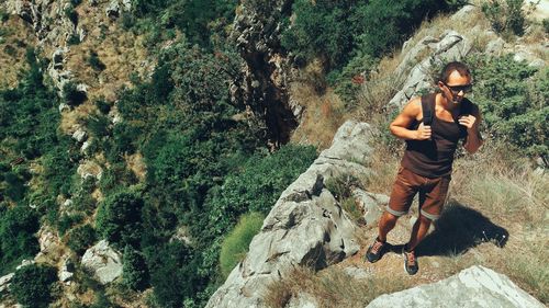 High angle view of woman walking on footpath