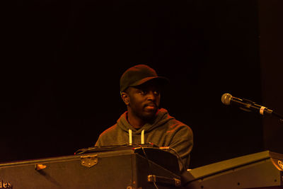 Young man playing at music concert