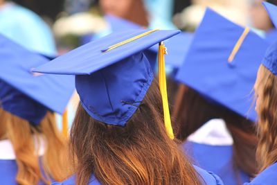 Rear view of girls wearing mortarboard