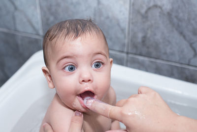 Portrait of baby boy in bathroom