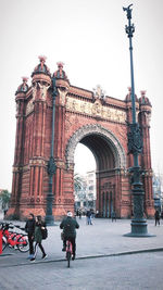 Group of people in front of historical building