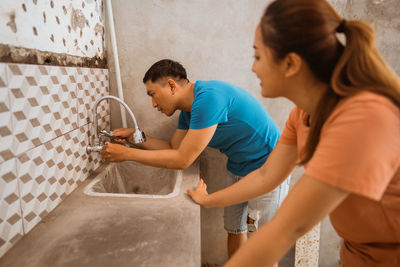 Side view of man working at home