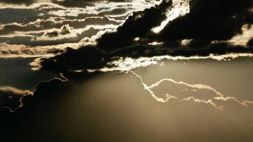 Low angle view of clouds in sky at sunset