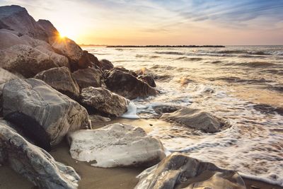 Scenic view of sea against sky during sunset