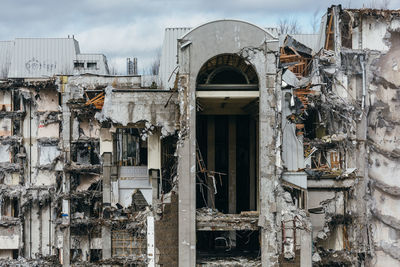 Destroyed building, protruding reinforcement. demolition of a building, house ruins, reconstruction