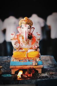 Close-up of statue against temple