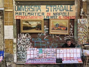 Portrait of man with text in store