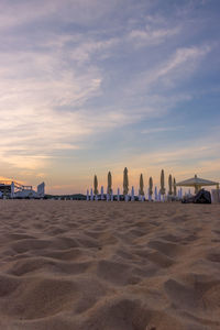 Panoramic view of beach against sky during sunset