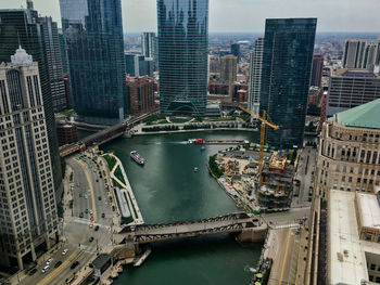 High angle view of river amidst buildings in city