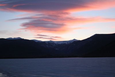 Scenic view of lake against sky during sunset