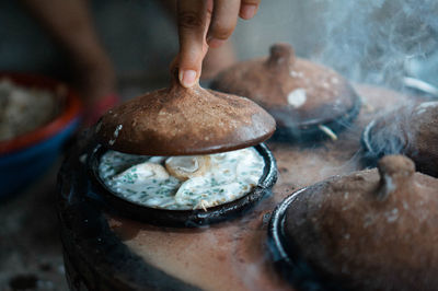 Close-up of person preparing food