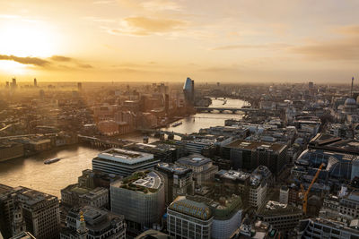 High angle view of city buildings during sunset