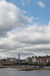 View of buildings against cloudy sky