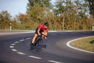 Man riding bicycle on road