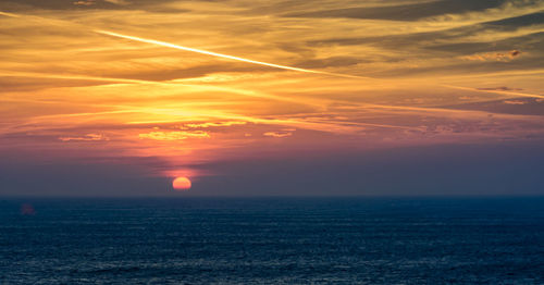 View of calm sea at sunset