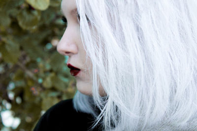 Close-up of beautiful woman with dyed hair