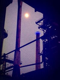 Low angle view of illuminated street light at night