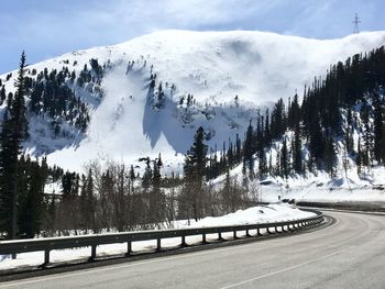 Scenic view of snow covered mountains against sky