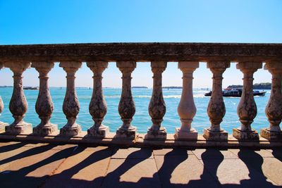 View of sea against clear blue sky