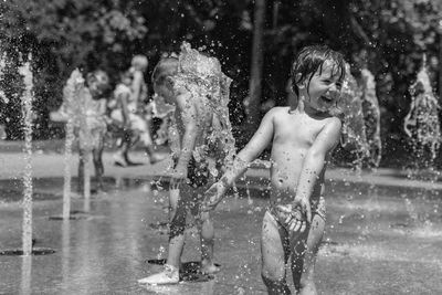 View of people splashing water