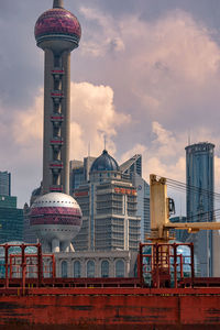Modern buildings in city against sky