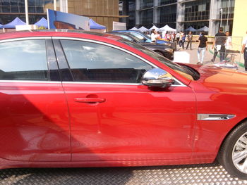 View of red car parked in city
