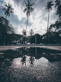 View of swimming pool by lake against sky