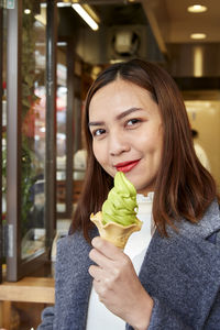 Portrait of woman eating food