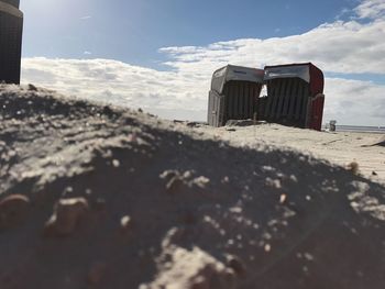 Lifeguard hut on beach against sky