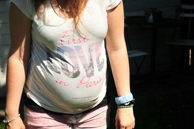 Midsection of woman standing at home