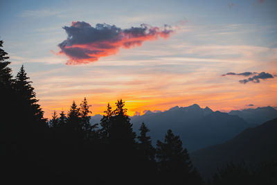 Scenic view of silhouette mountains against sky during sunset