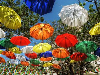 Umbrellas creating a sunshade over a street in spain