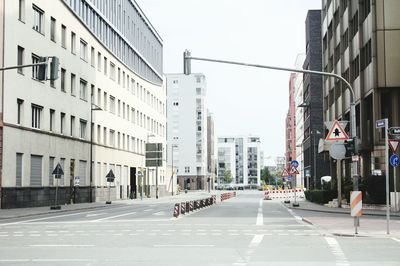 Road passing through city buildings