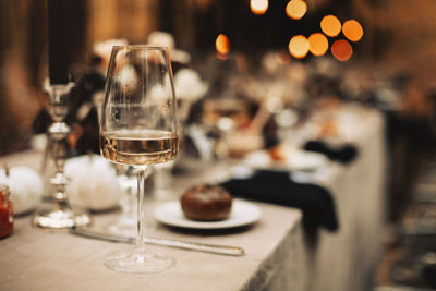 Close-up of wineglasses on table