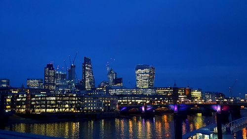 Illuminated buildings at waterfront