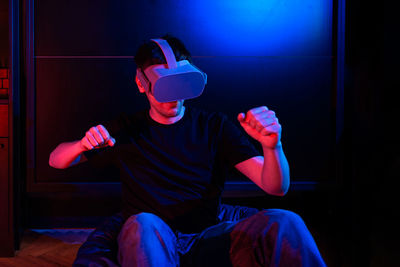 Gamer man wearing virtual reality goggles