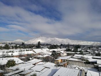 High angle view of snow on roof against sky