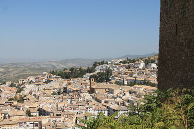 Aerial view of town against clear blue sky