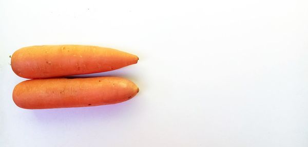 Close-up of orange over white background