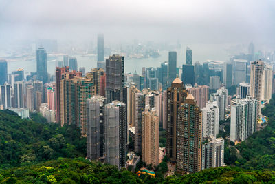 Aerial view of modern buildings in city against sky